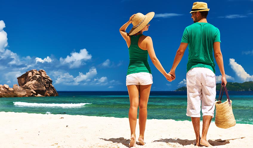 Couple_relaxing_on_a_tropical_beach